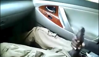 Big black cock stroking in car