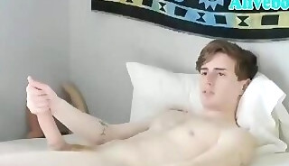 pretty american Lad with Some tattoos strokes his big dick on webcam