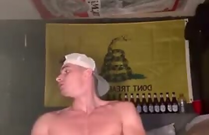 Muscular Dude Jacking Off Below The American Flag And In Front Of The Gadsden Flag
