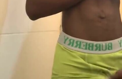 Sexy teen with abs stroking his big black cock in public