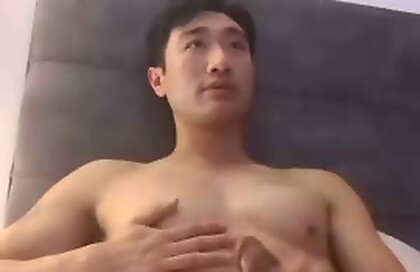 Hot Asian guy getting sucked and cumming thick load