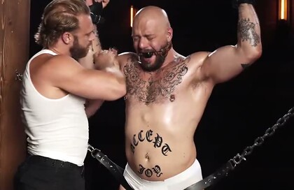 Gagged Muscle Stud Gunnar Gets Chained, Spanked and Edged by Brogan Until He Begs to Cum