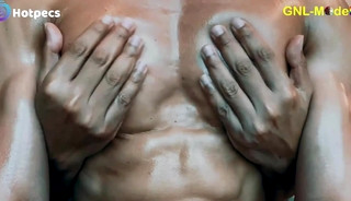 Enjoying a hot oil massage to his hot pecs and pointy nipples!