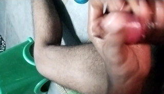 Rubbing dick with oil